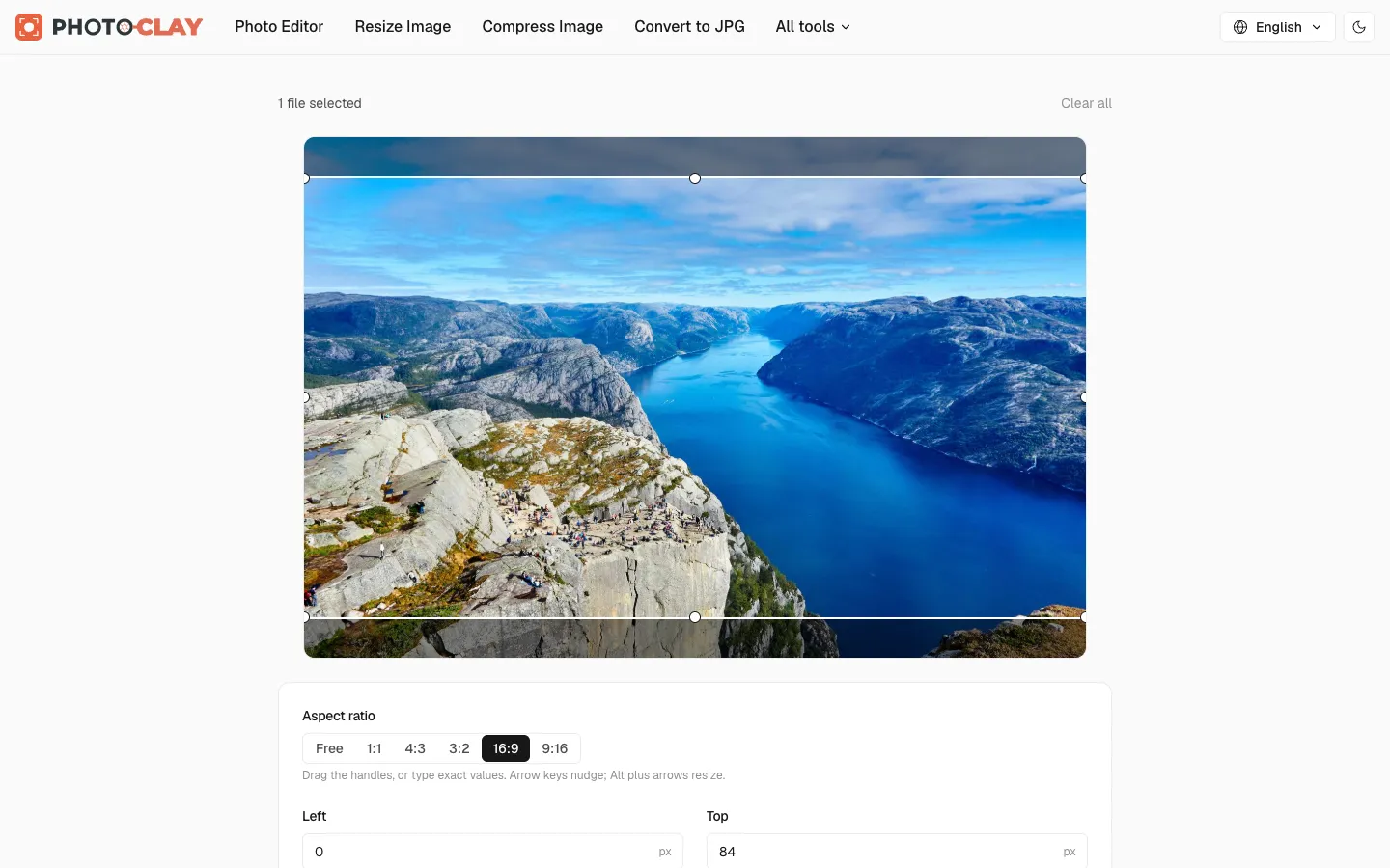 Crop Image tool with a 16:9 crop box over a landscape photo